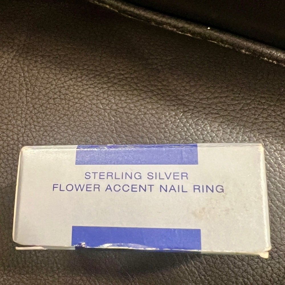Vintage Avon Sterling Silver Flower Accent Ring new in unopened plastic.
